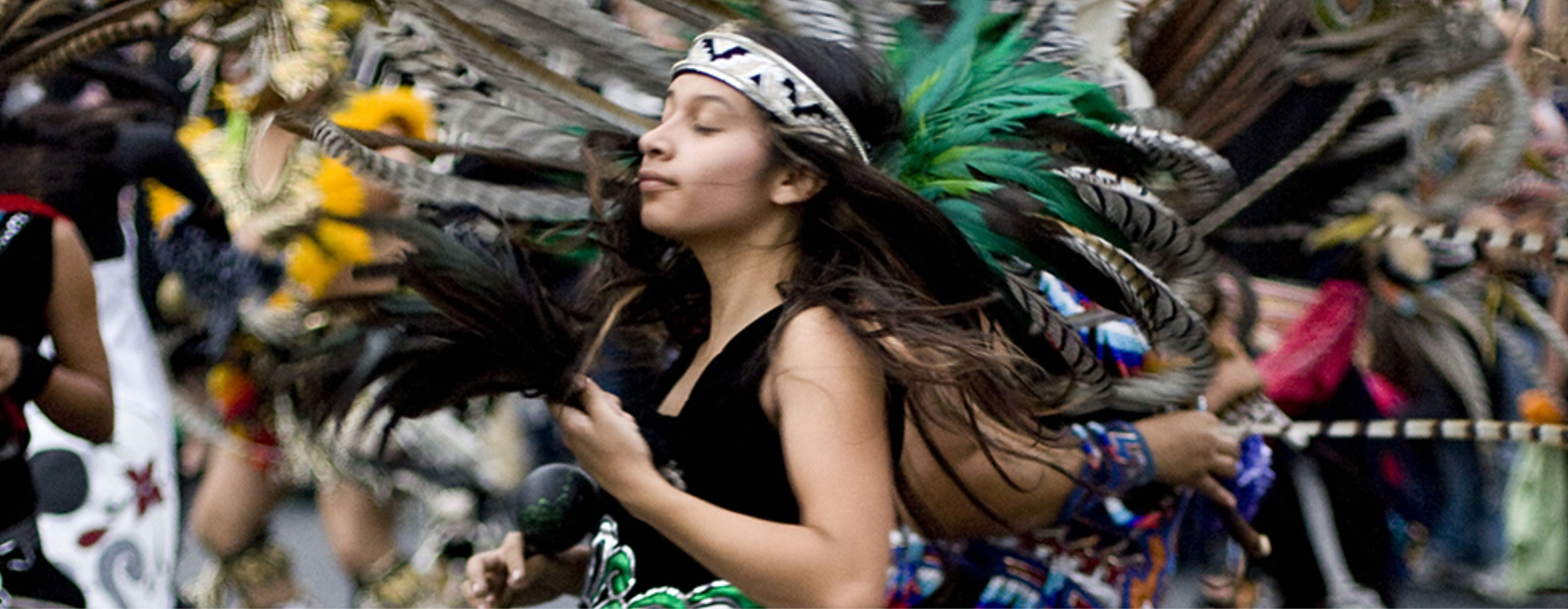Woman in traditional garb dancing