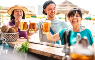 Two women and a man enjoying breweries in Puerto Vallarta.