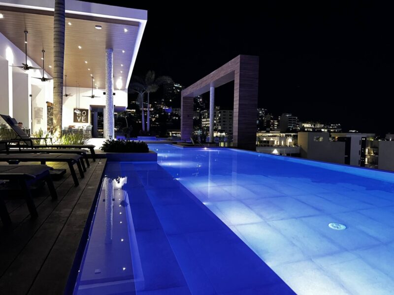 The Desire rooftop pool lit up at night