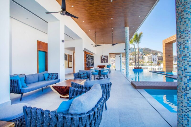 Sofas in the covered lounge next to the Desire rooftop pool