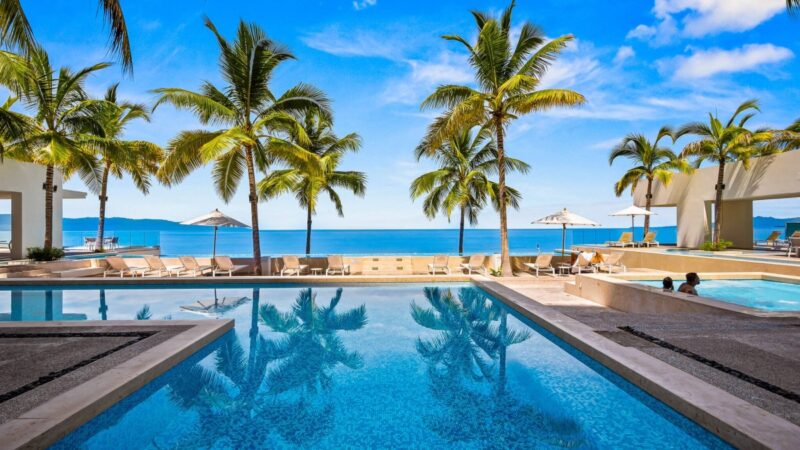 The Harbor 171 pools and palms facing the ocean