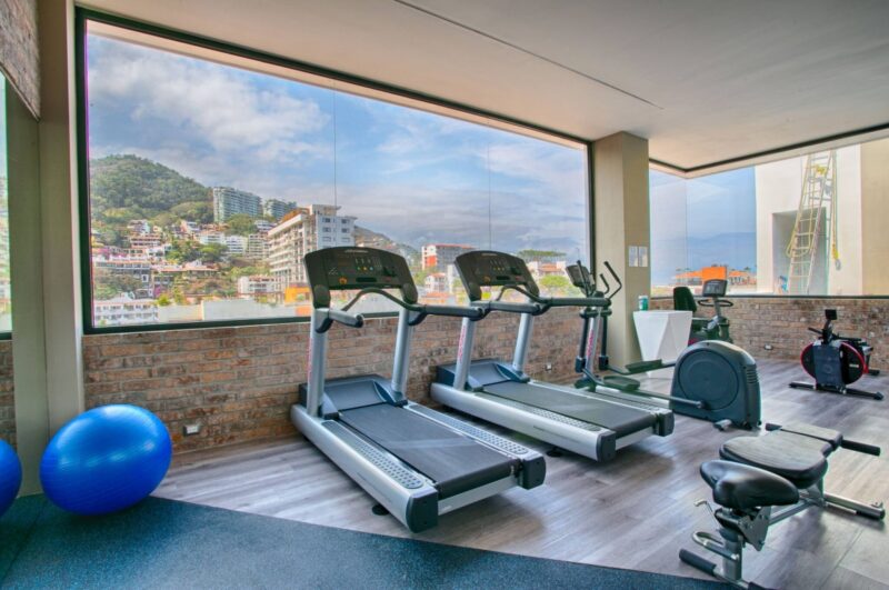 The Loft 268 rooftop gym, with mountain views