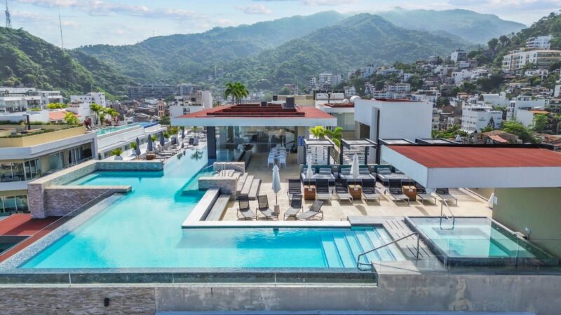 The Loft 268 rooftop infinity pool, with the mountains behind