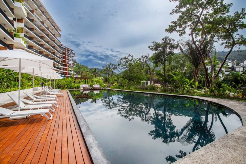 The garden pool at Oasis among the trees by the Cuale river