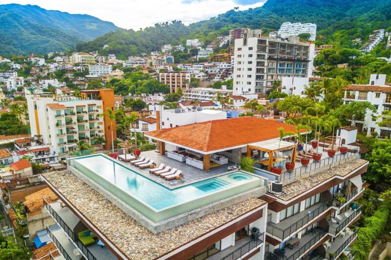 Aerial view of the Oceana rooftop pool above the Romantic Zone, with the mountains behind