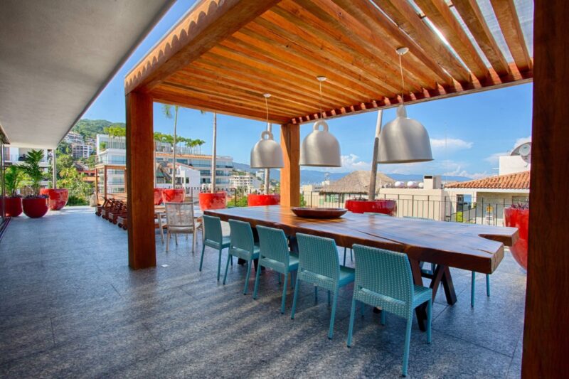 The shaded dining table and BBQ area on the Oceana rooftop