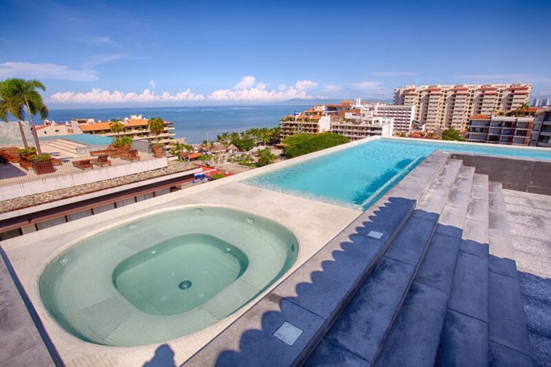 The Oceana rooftop lap pool and hot tub, with Banderas Bay beyond