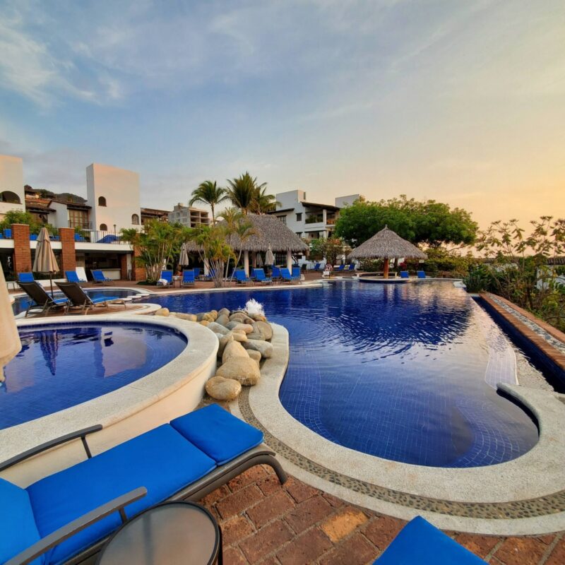 The Selva Romantica pool and hot tub at sunset