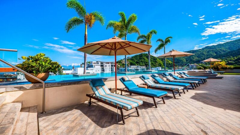 Loungers and umbrellas along the Zenith rooftop pool