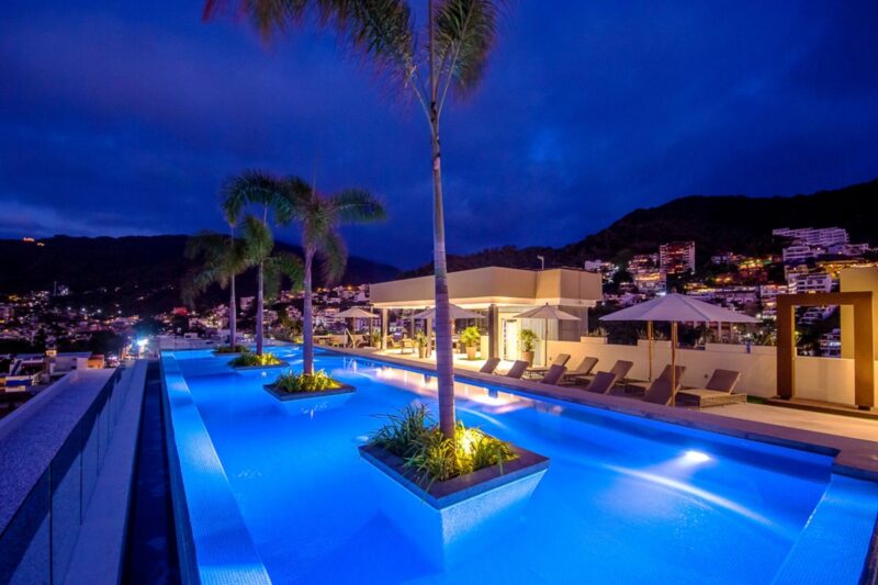 The Zenith rooftop pool lit up at night